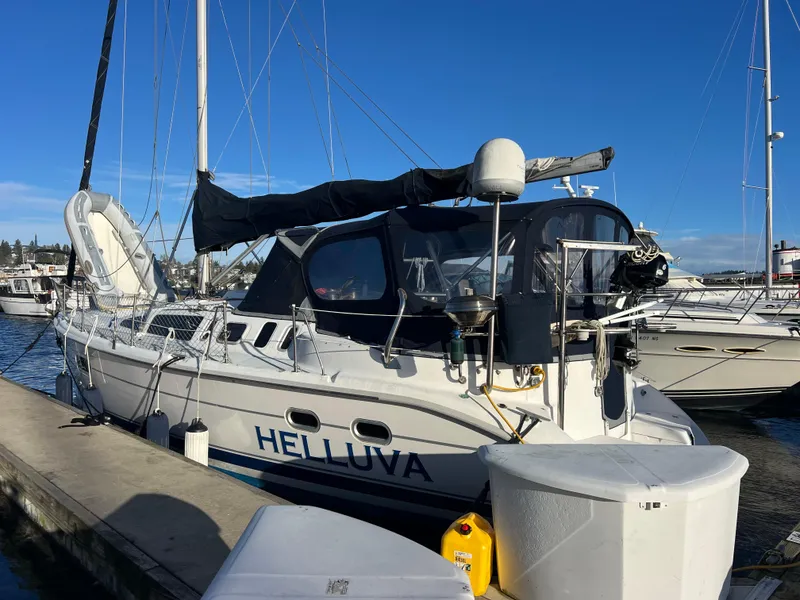 The Image of Sailboat "Helluva" docked, Hunter 410 model, 2000, in marina setting. - 0