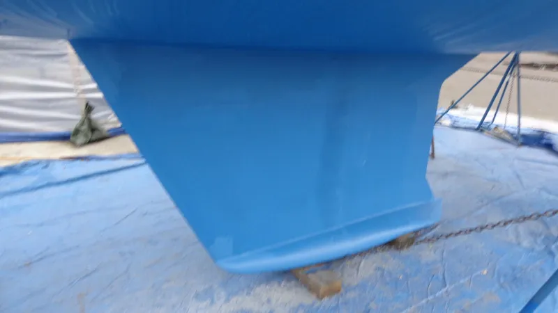 Slide: The Image of Blue Hunter 410 sailboat keel and propeller on tarp, 2000 model. - 10