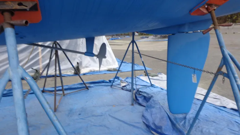 Slide: The Image of Blue keel of a 2000 Hunter 410 sailboat on a tarp. - 11