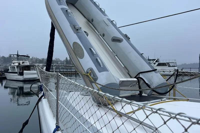 Slide: The Image of Inflatable boat on a 2000 Hunter 410 yacht, docked in a marina. - 13