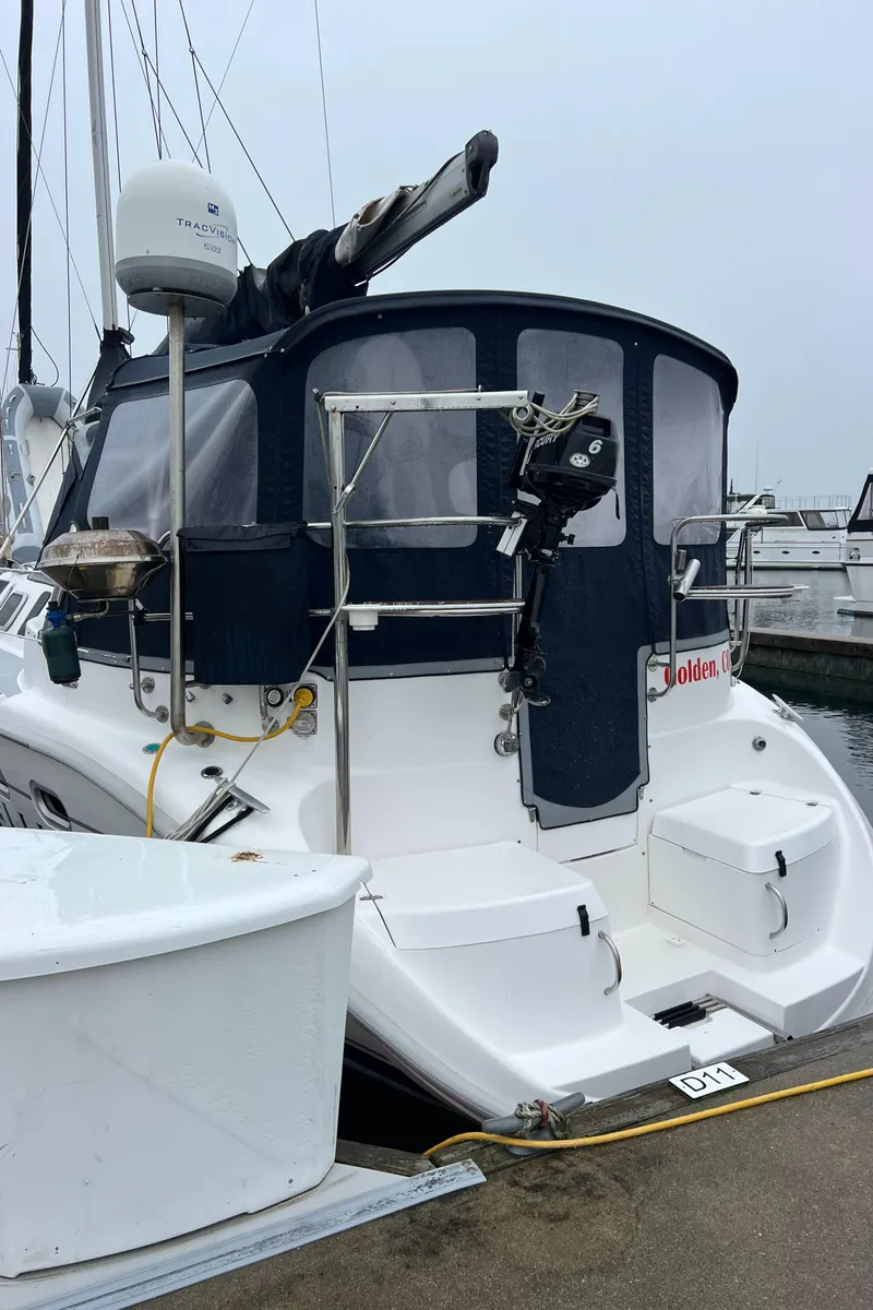 Slide: The Image of Hunter 410 sailboat from 2000 docked at marina, with clear blue sky. - 3