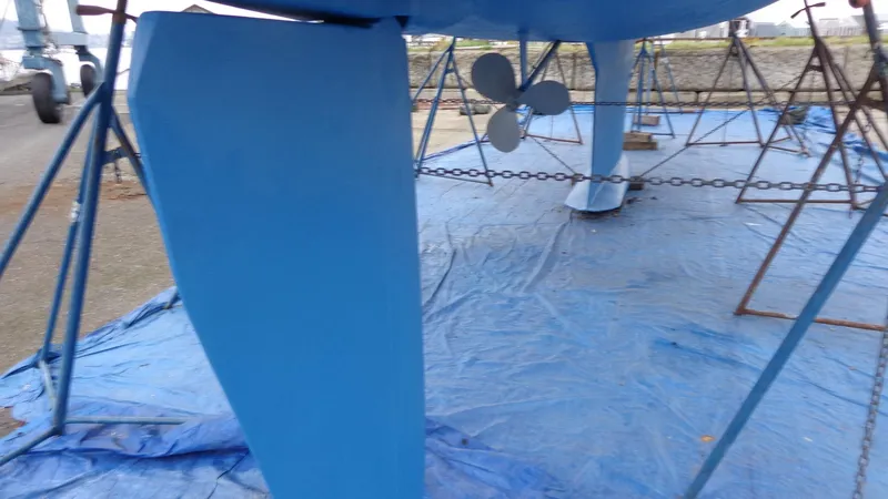 Slide: The Image of Hunter 410 sailboat named "Helluva" on stands for maintenance, 2000 model. - 9