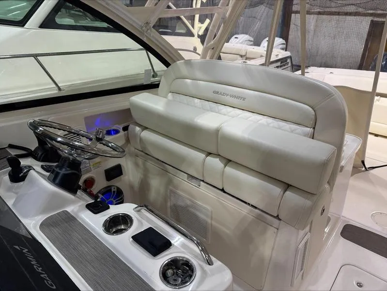 Slide: The Image of 2024 Grady-White 375 Freedom boat interior with plush seating and modern controls. - 13