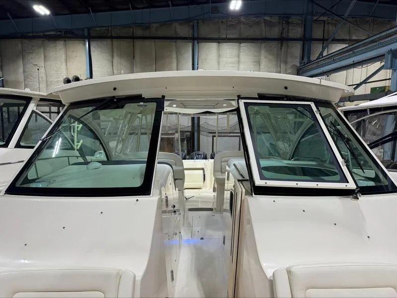 Slide: The Image of 2024 Grady-White 375 Freedom boat interior, showcasing sleek design and spacious seating. - 4