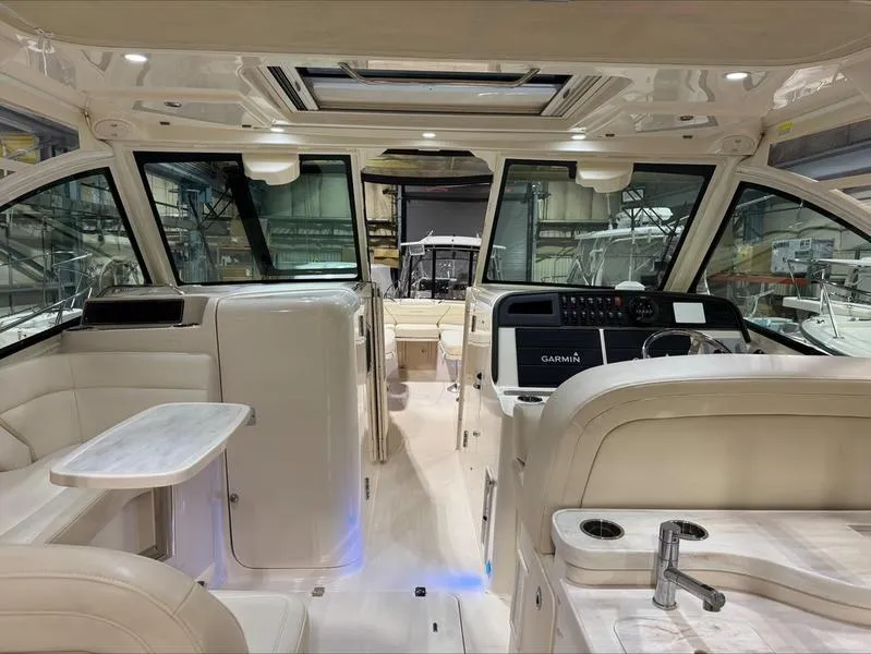 Slide: The Image of 2024 Grady-White 375 Freedom boat interior with modern design and luxurious seating. - 6