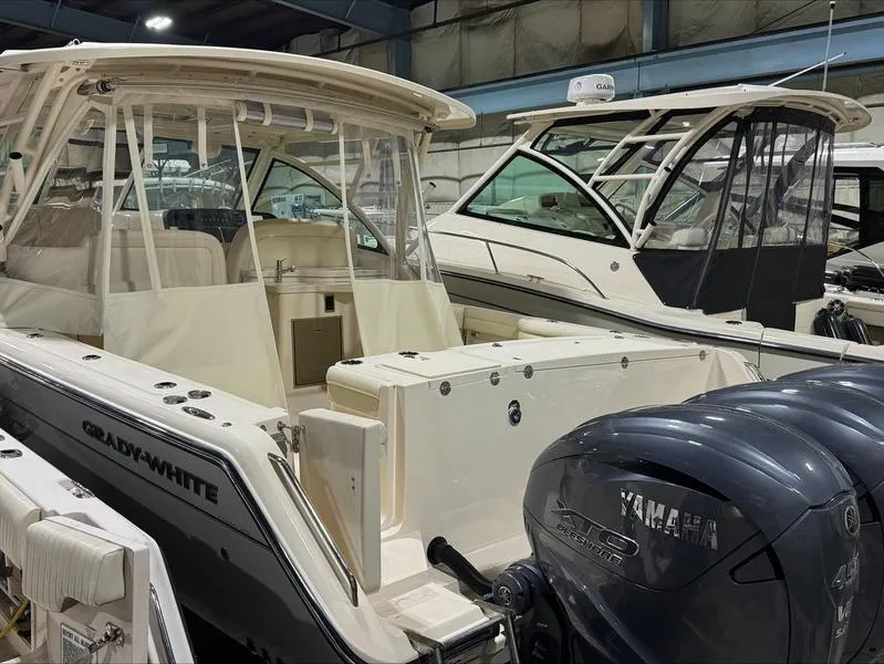 Slide: The Image of 2024 Grady-White 375 Freedom boat with Yamaha engines in a showroom. - 8
