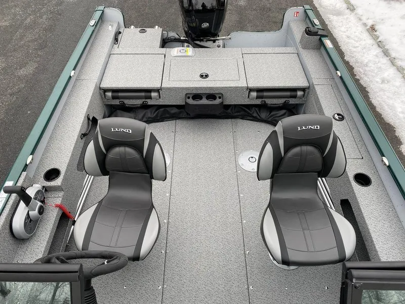 Slide: The Image of 2025 Lund 1775 Adventure Sport boat interior with two seats and storage compartments. - 11