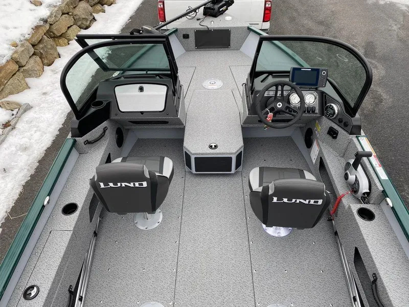 Slide: The Image of 2025 Lund 1775 Adventure Sport boat interior with dual seats and modern dashboard. - 8