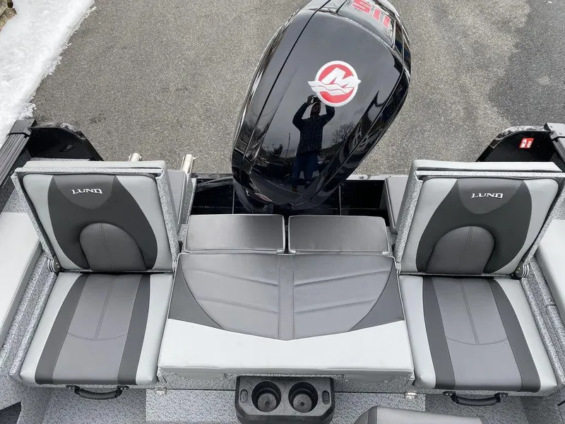 Slide: The Image of 2025 Lund 1775 Impact XS SS boat seats and motor, featuring sleek design and comfortable seating. - 14