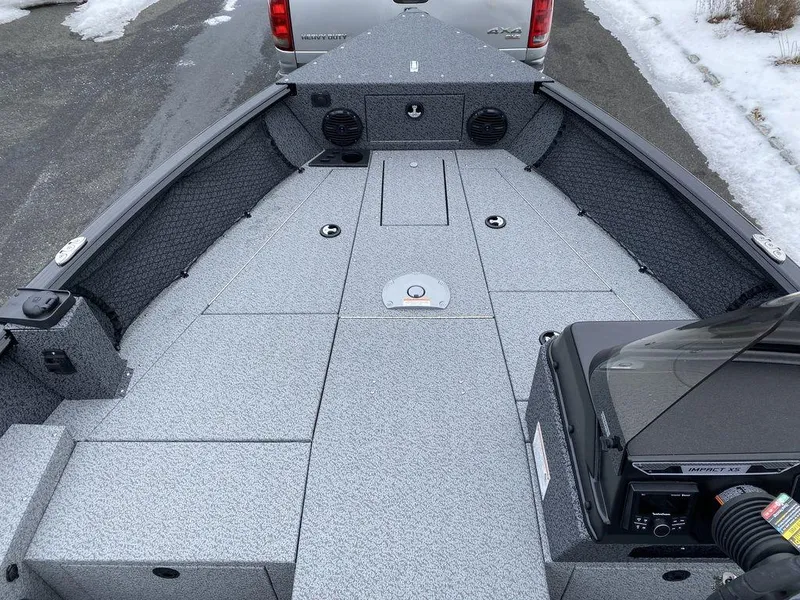 Slide: The Image of 2025 Lund 1775 Impact XS SS boat interior with spacious deck and storage compartments. - 8