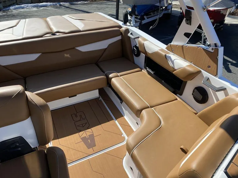 Slide: The Image of Luxurious interior of 2025 Axis A20 boat with tan leather seating. - 12