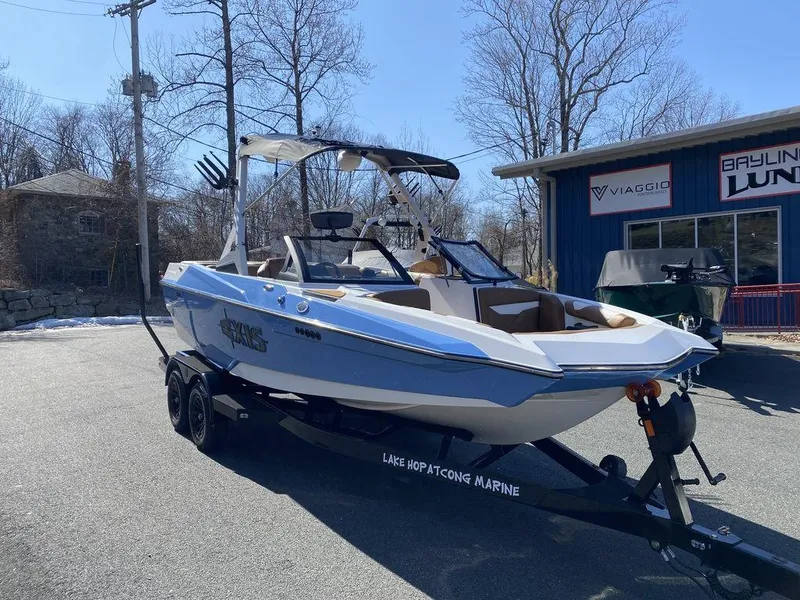 Slide: The Image of 2025 Axis A20 boat on trailer at Lake Hopatcong Marine dealership. - 14