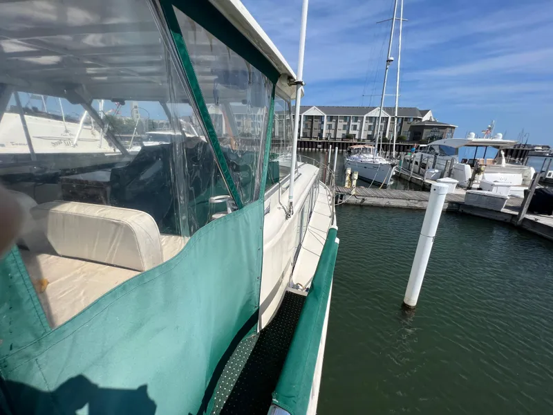 Slide: The Image of 1967 Hatteras 41 Twin Cabin docked at marina, clear day. - 11