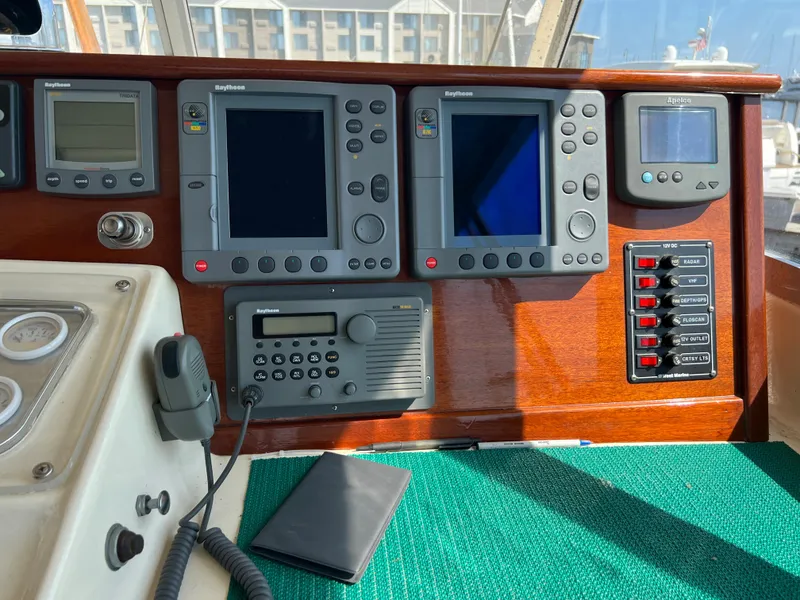 Slide: The Image of Control panel of a 1967 Hatteras 41 Twin Cabin boat with navigation equipment. - 22