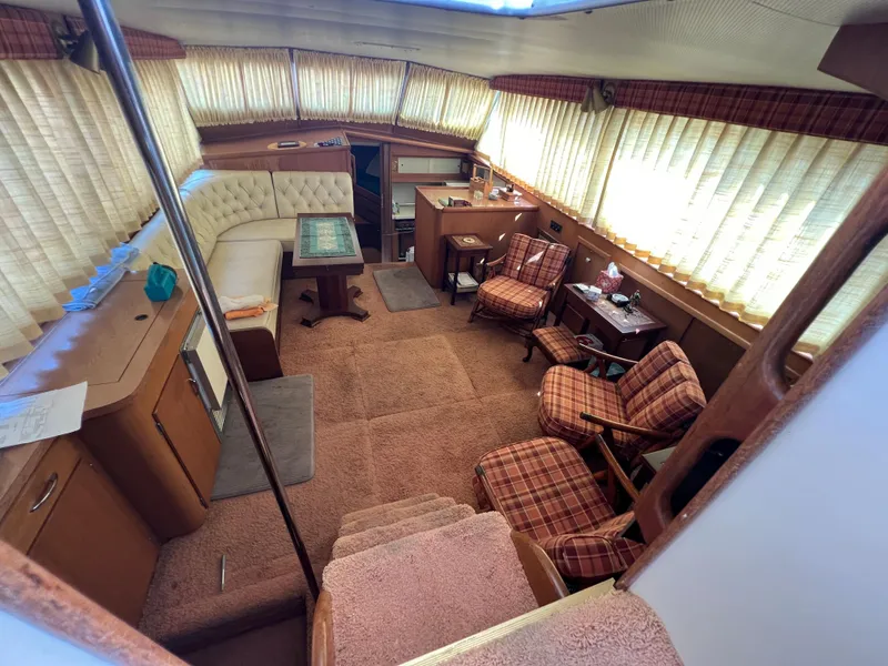 Slide: The Image of Interior of 1967 Hatteras 41 Twin Cabin with vintage decor and seating area. - 25