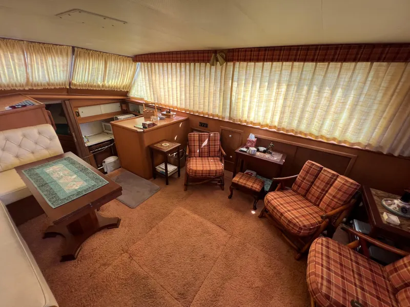 Slide: The Image of Interior of 1967 Hatteras 41 Twin Cabin with vintage decor and seating area. - 27
