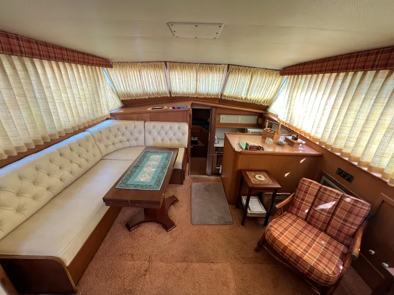 Slide: The Image of Interior of 1967 Hatteras 41 Twin Cabin with vintage decor and seating area. - 28