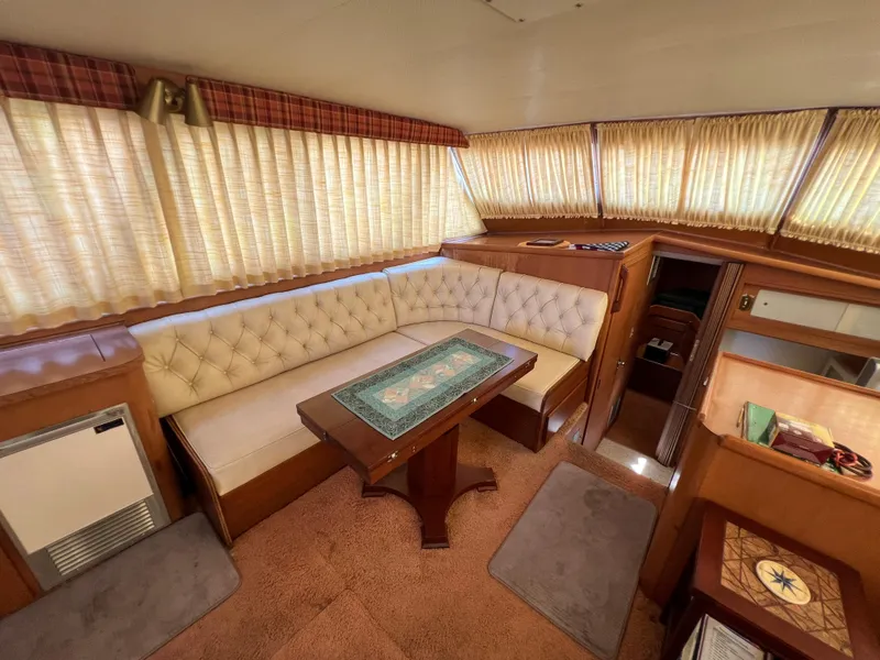 Slide: The Image of Interior of 1967 Hatteras 41 Twin Cabin with vintage seating and table. - 29