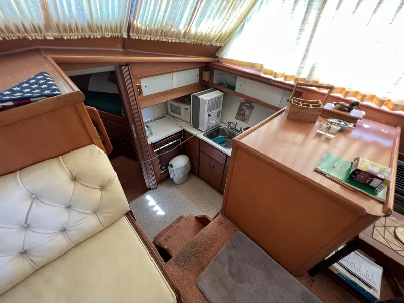 Slide: The Image of Interior of 1967 Hatteras 41 Twin Cabin with kitchenette and seating area. - 36