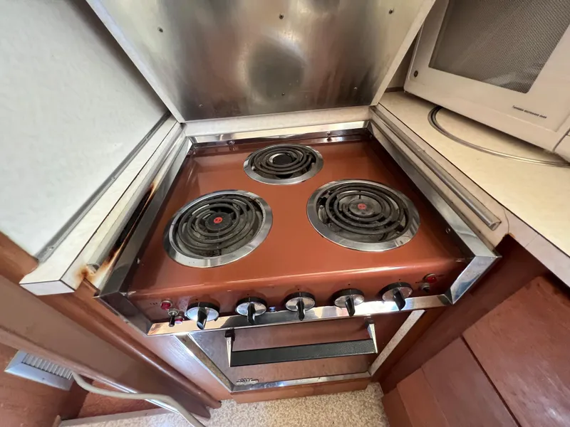 Slide: The Image of Vintage stove in 1967 Hatteras 41 Twin Cabin yacht kitchen. - 40