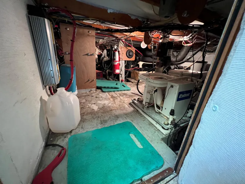 Slide: The Image of Engine room of 1967 Hatteras 41 Twin Cabin with equipment and wiring. - 45