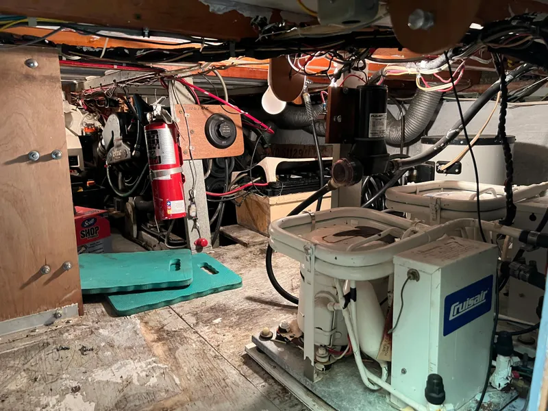 Slide: The Image of Engine room of 1967 Hatteras 41 Twin Cabin with equipment and fire extinguisher. - 46