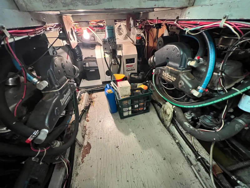 Slide: The Image of Engine room of 1967 Hatteras 41 Twin Cabin with Onan generator and Lehman engines. - 48