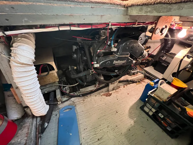 Slide: The Image of Engine room of 1967 Hatteras 41 Twin Cabin with visible wiring and equipment. - 49