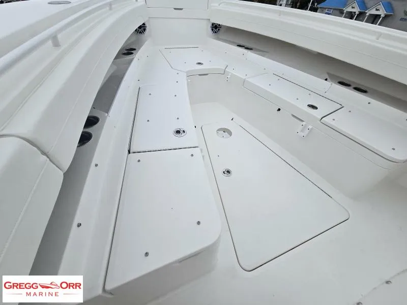 Slide: The Image of 2025 Regulator 31 boat interior with storage compartments, showcased by Gregg Orr Marine. - 14