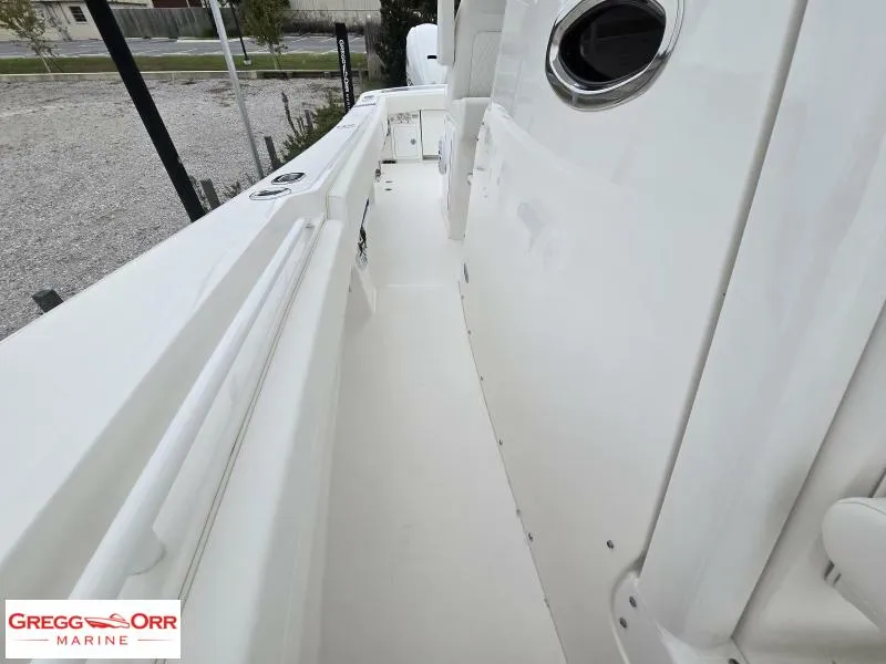 Slide: The Image of 2025 Regulator 31 boat deck, white interior, side view, Gregg Orr Marine. - 18
