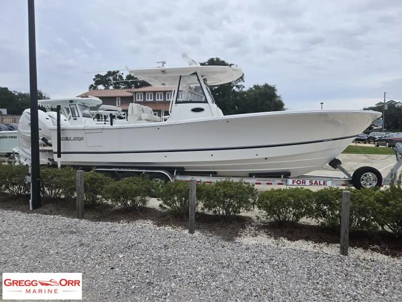 Slide: The Image of 2025 Regulator 31 boat on trailer, for sale at Gregg Orr Marine. - 3