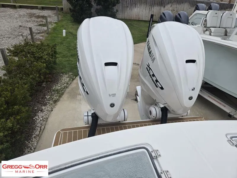 Slide: The Image of 2025 Regulator 31 boat with twin Yamaha V8 outboard engines at Gregg Orr Marine. - 6