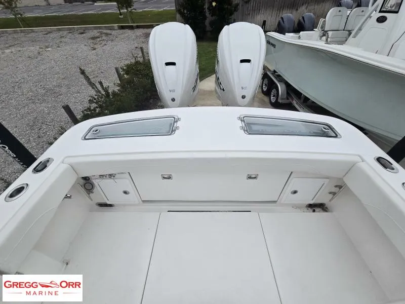 Slide: The Image of 2025 Regulator 31 boat with dual outboard engines at Gregg Orr Marine. - 7