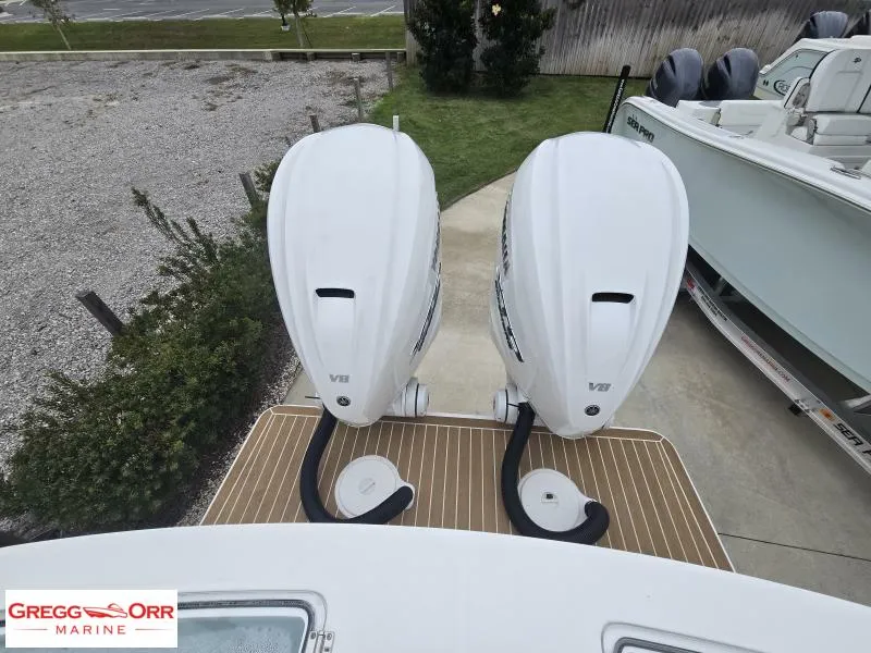 Slide: The Image of 2025 Regulator 31 boat with twin V8 outboard engines at Gregg Orr Marine. - 8