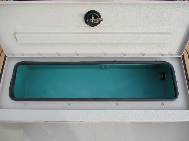 Slide: The Image of Open storage compartment of 2025 Avid Rogue 20 SC boat. - 10