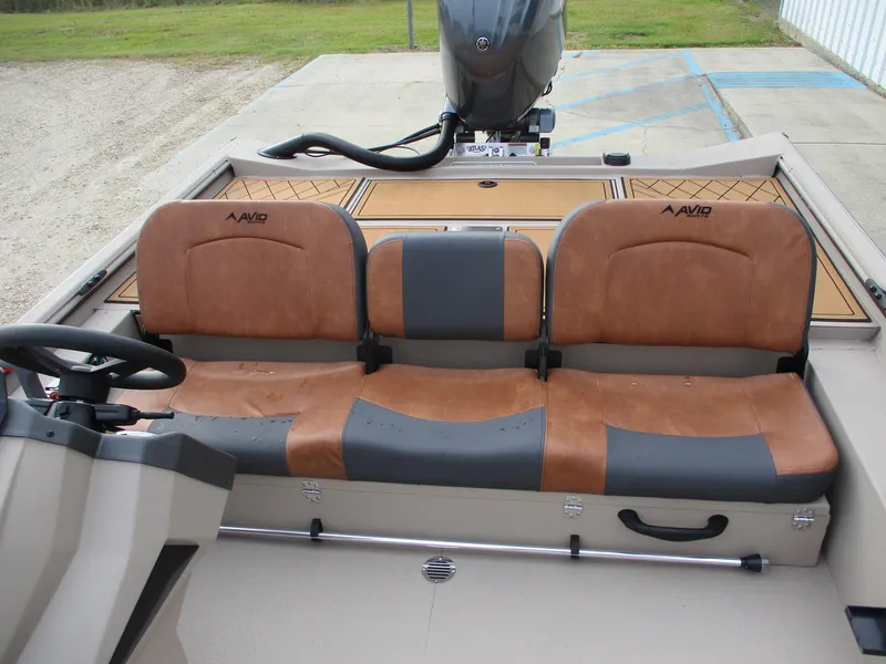 Slide: The Image of Avid Rogue 20 SC 2025 boat interior with brown and gray seating. - 11