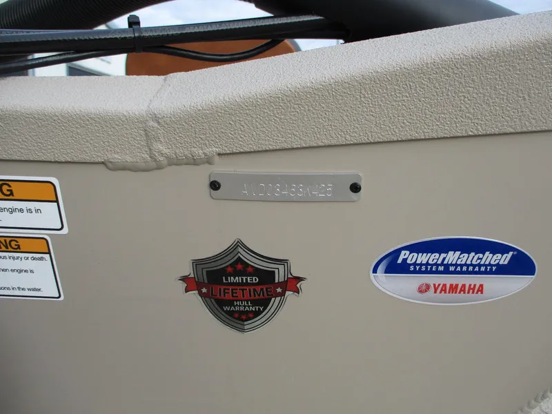 Slide: The Image of Avid Rogue 20 SC 2025 boat with warranty badges and warning labels. - 12