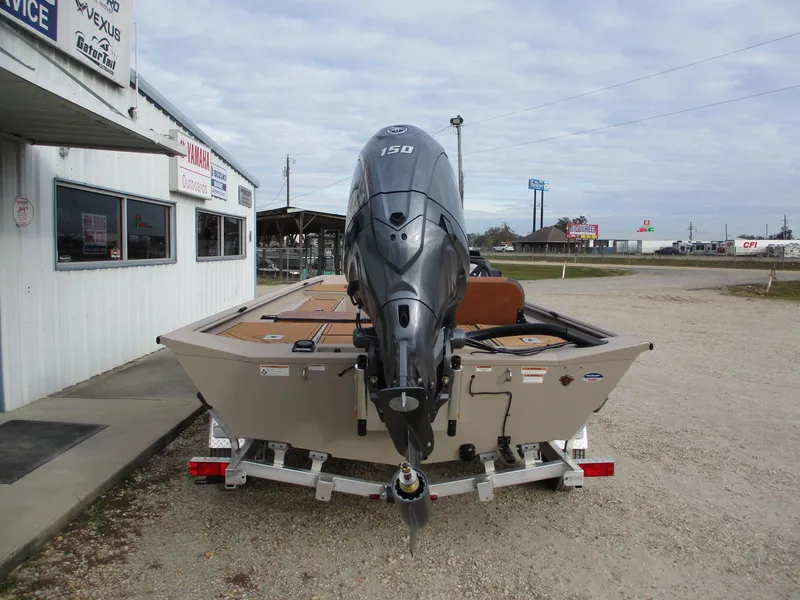 Slide: The Image of 2025 Avid Rogue 20 SC boat with 150 HP engine on trailer. - 6