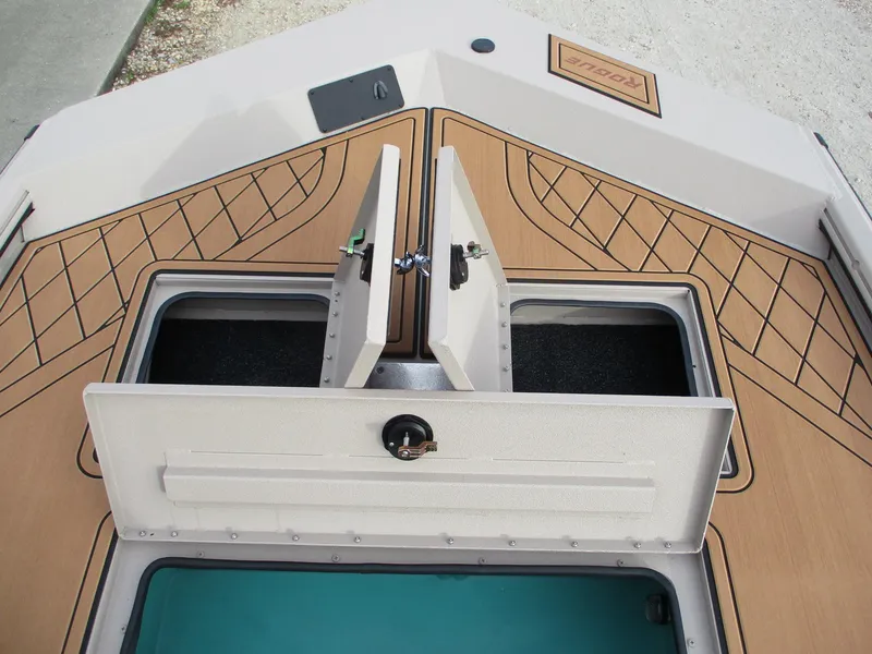 Slide: The Image of Avid Rogue 20 SC 2025 boat deck with open storage compartments. - 9