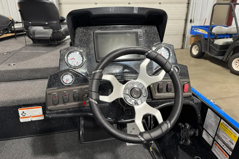 Slide: The Image of Steering console of a 2023 Nitro Z18 boat with gauges and controls. - 11