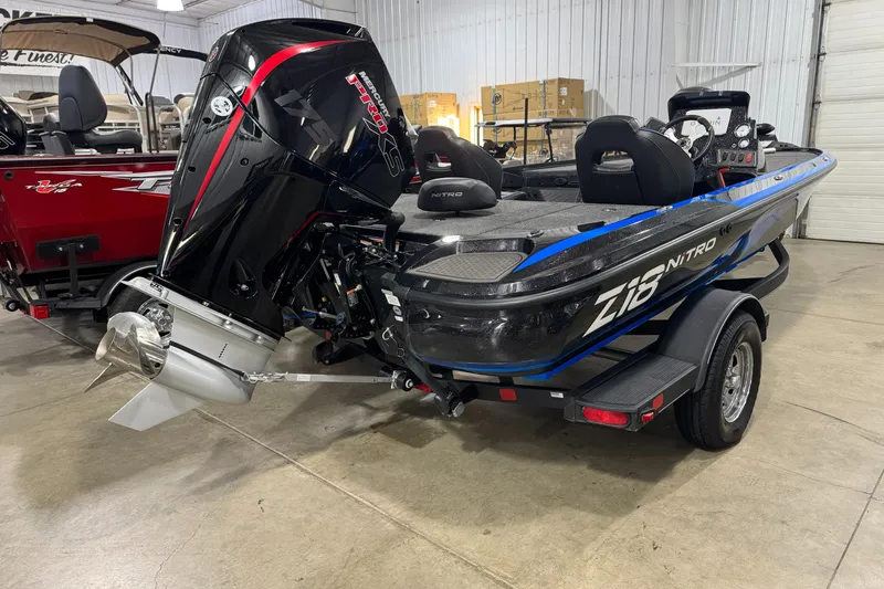 Slide: The Image of 2023 Nitro Z18 boat with powerful outboard motor in a showroom. - 2
