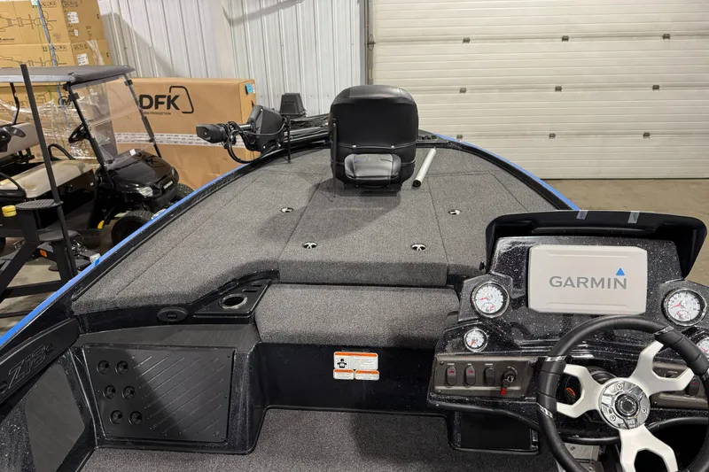 Slide: The Image of 2023 Nitro Z18 boat interior with Garmin navigation system in a garage setting. - 5