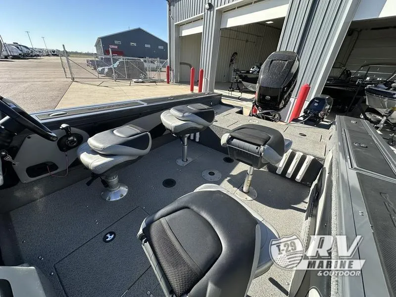Slide: The Image of 2018 Targa 19 boat interior with seating and steering wheel at RV Marine dealership. - 10
