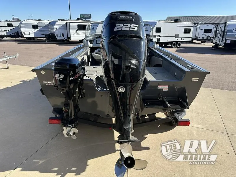 Slide: The Image of 2018 Targa 19 boat with dual outboard motors in a dealership lot. - 4