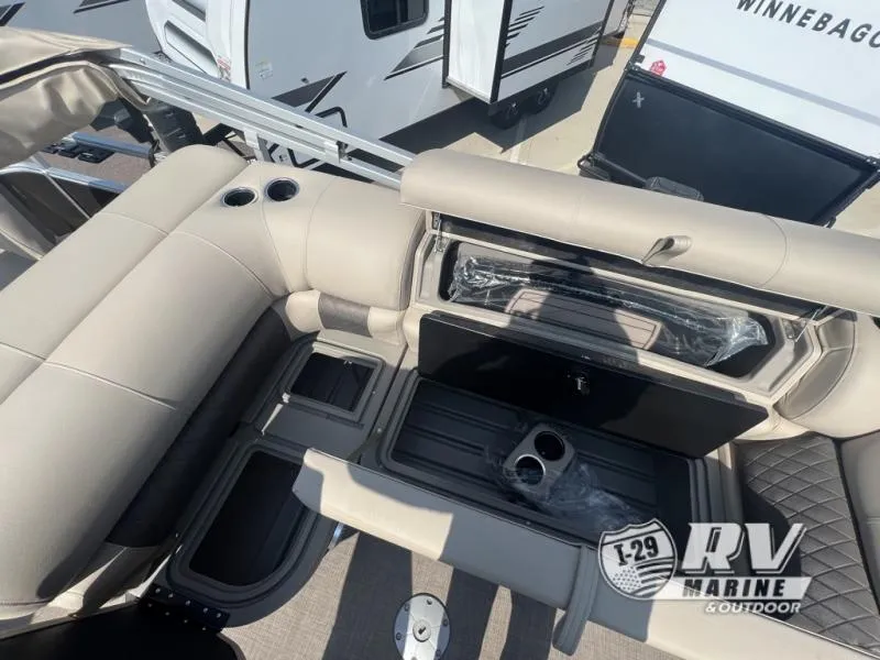 Slide: The Image of 2023 Sportfish 20 DLX boat interior with beige seating and cup holders. - 12