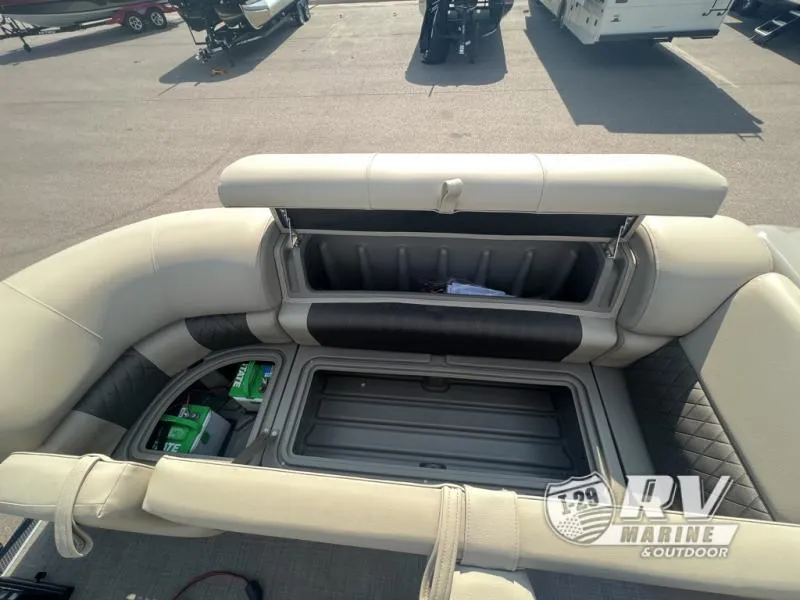 Slide: The Image of 2023 Sportfish 20 DLX boat interior with open storage compartments. - 14