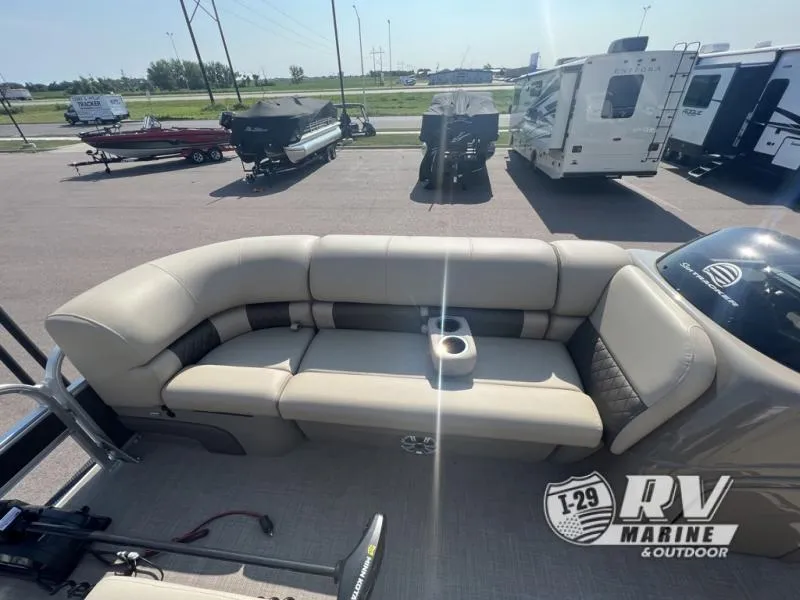 Slide: The Image of 2023 Sportfish 20 DLX boat interior with beige seating and cup holder, displayed at RV Marine. - 15