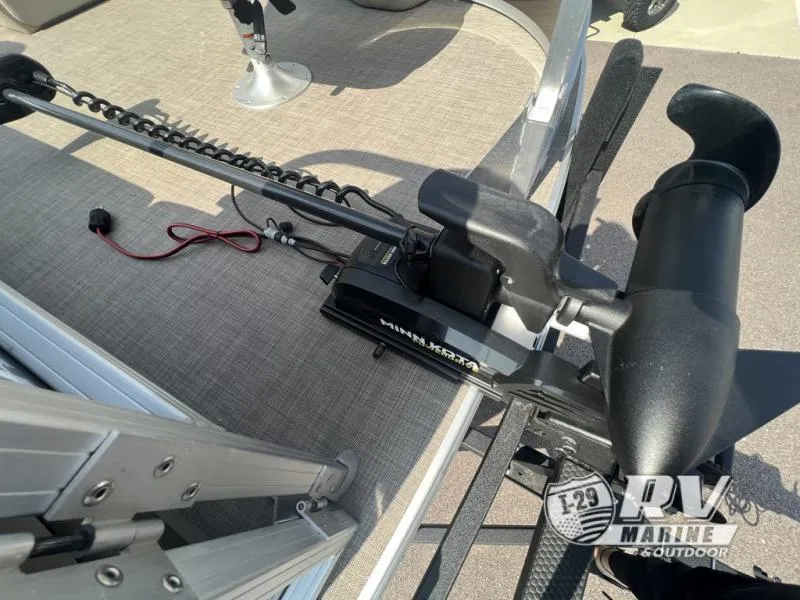 Slide: The Image of 2023 Sportfish 20 DLX boat with Minn Kota trolling motor on deck. - 18