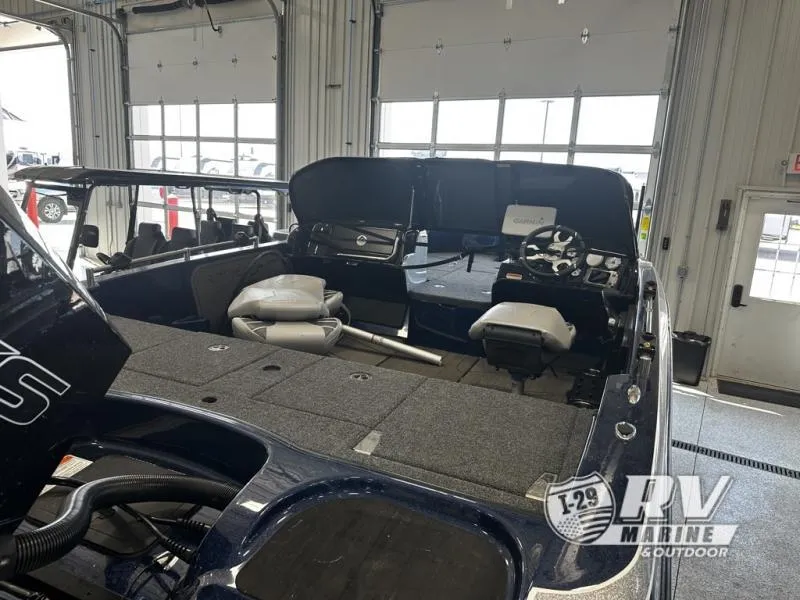 Slide: The Image of 2024 White River ZV19 boat interior in showroom, featuring spacious seating and modern controls. - 15