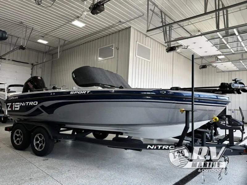 Slide: The Image of 2024 White River ZV19 boat in a showroom, on a trailer. - 21